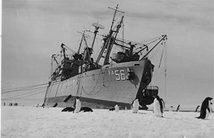 Arneb listing to repair ice damage to hull, Operation Deep Freeze II, 1957